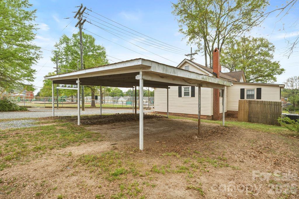 625 North Main Street Kannapolis, NC 28081 - Photo 26 of 26 a backyard of a house with plants and wooden fence