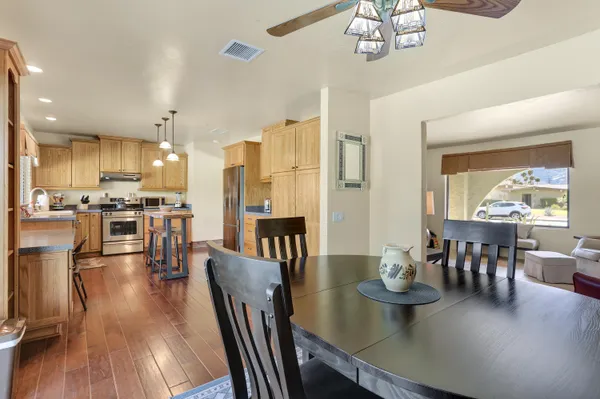 a view of a dining room with furniture window and wooden floor