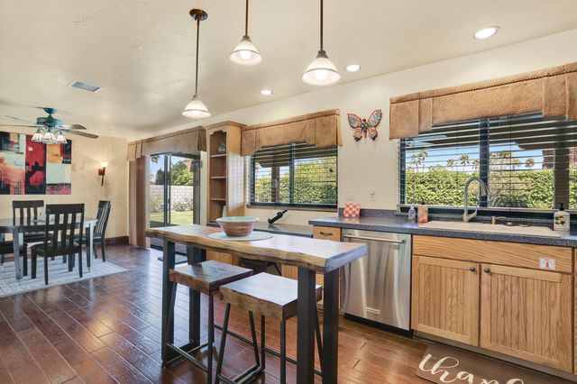 a kitchen with lots of counter space and dining table