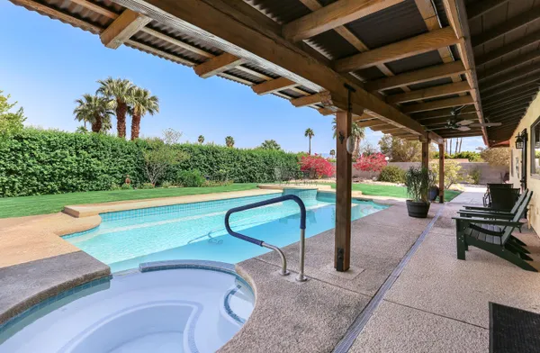 a view of a swimming pool with a patio