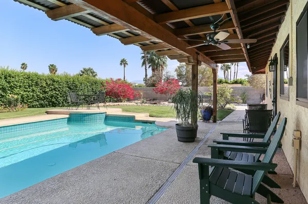 a view of a swimming pool with a patio