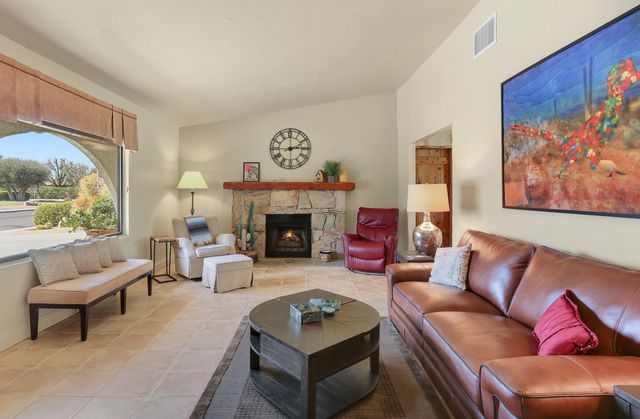 a living room with furniture or couch and a fireplace