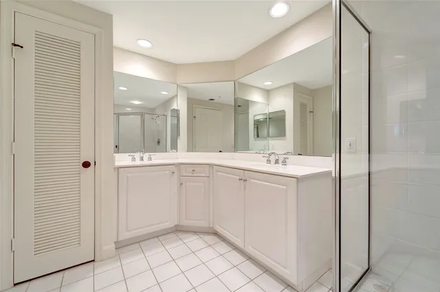 a bathroom with a sink vanity and a mirror