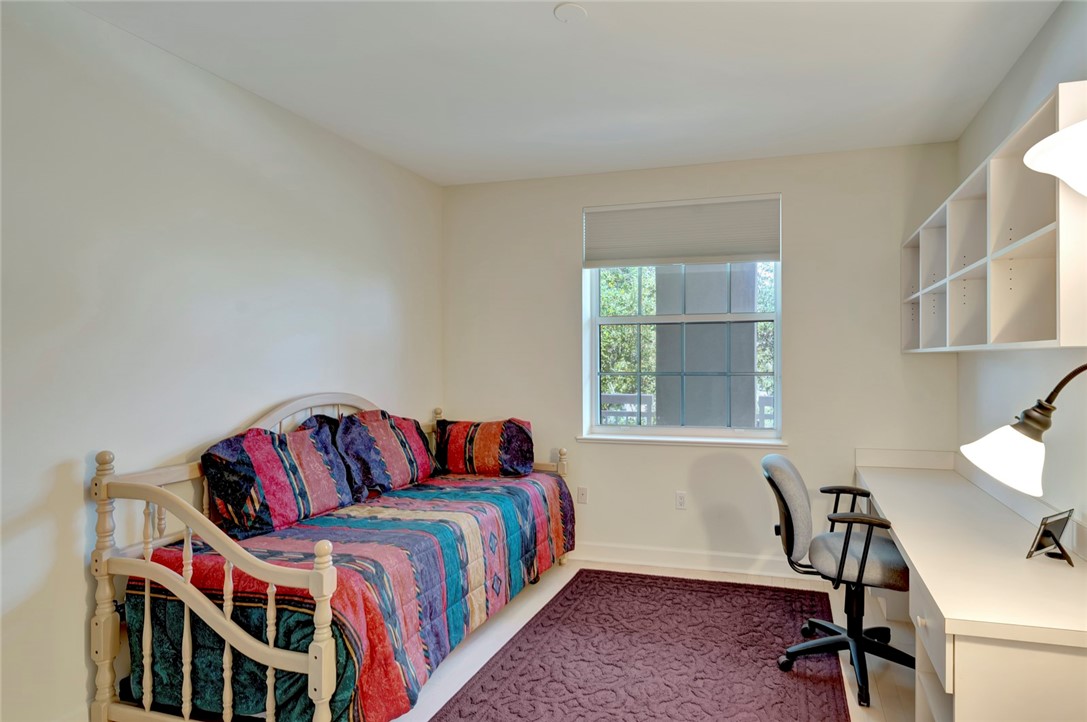 940 Turtle Cove Lane, Unit 208 Vero Beach, FL 32963 - Photo 26 of 35 a bedroom with a bed and a window