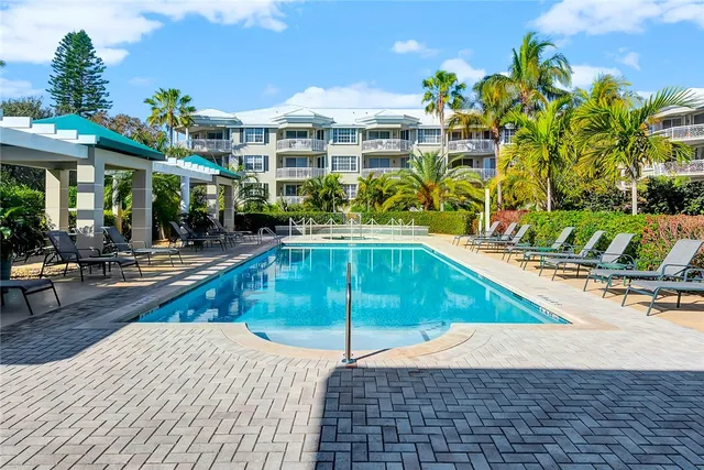 a view of a swimming pool with a lounge chairs