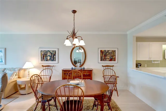 a view of a dining room furniture and chandelier