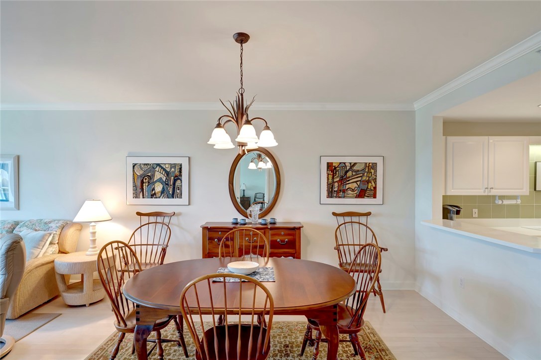 940 Turtle Cove Lane, Unit 208 Vero Beach, FL 32963 - Photo 6 of 35 a view of a dining room furniture and chandelier