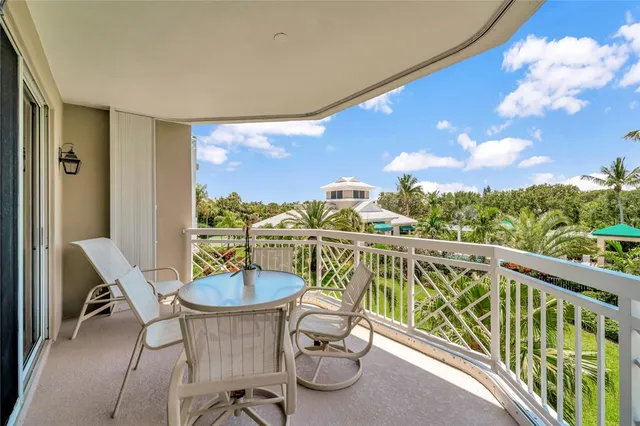 a view of a chairs and table in patio