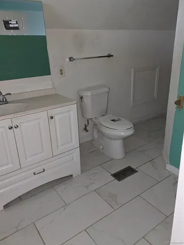 a bathroom with a toilet and a sink