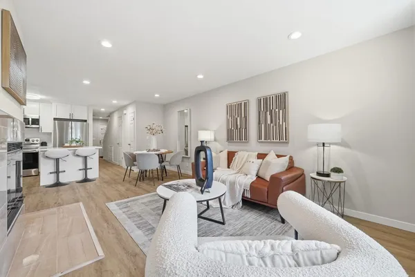 a living room with furniture and a table