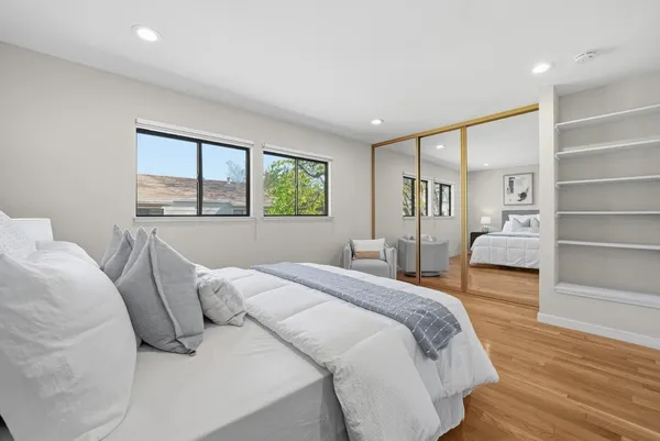 a bed room with a bed and a window