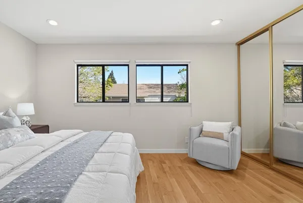 a bedroom with a bed and a couch