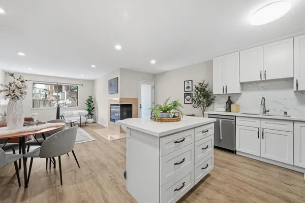 a kitchen with a table and chairs in it