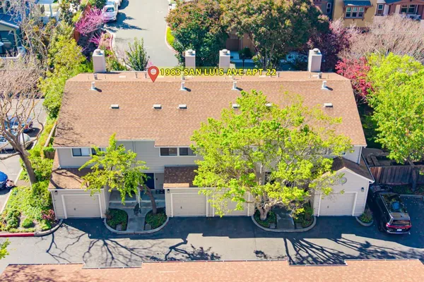 an aerial view of a house with a garden