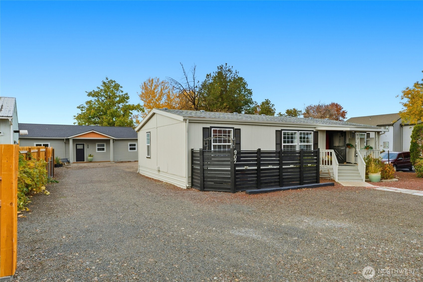 a view of a house with a yard and sitting area