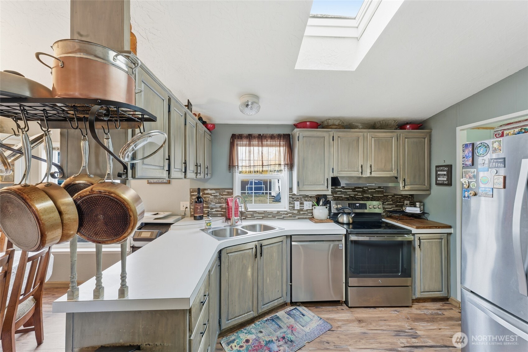 905 Cowl Street Milton Freewater, OR 97862 - Photo 27 of 32 a kitchen with a sink appliances and cabinets