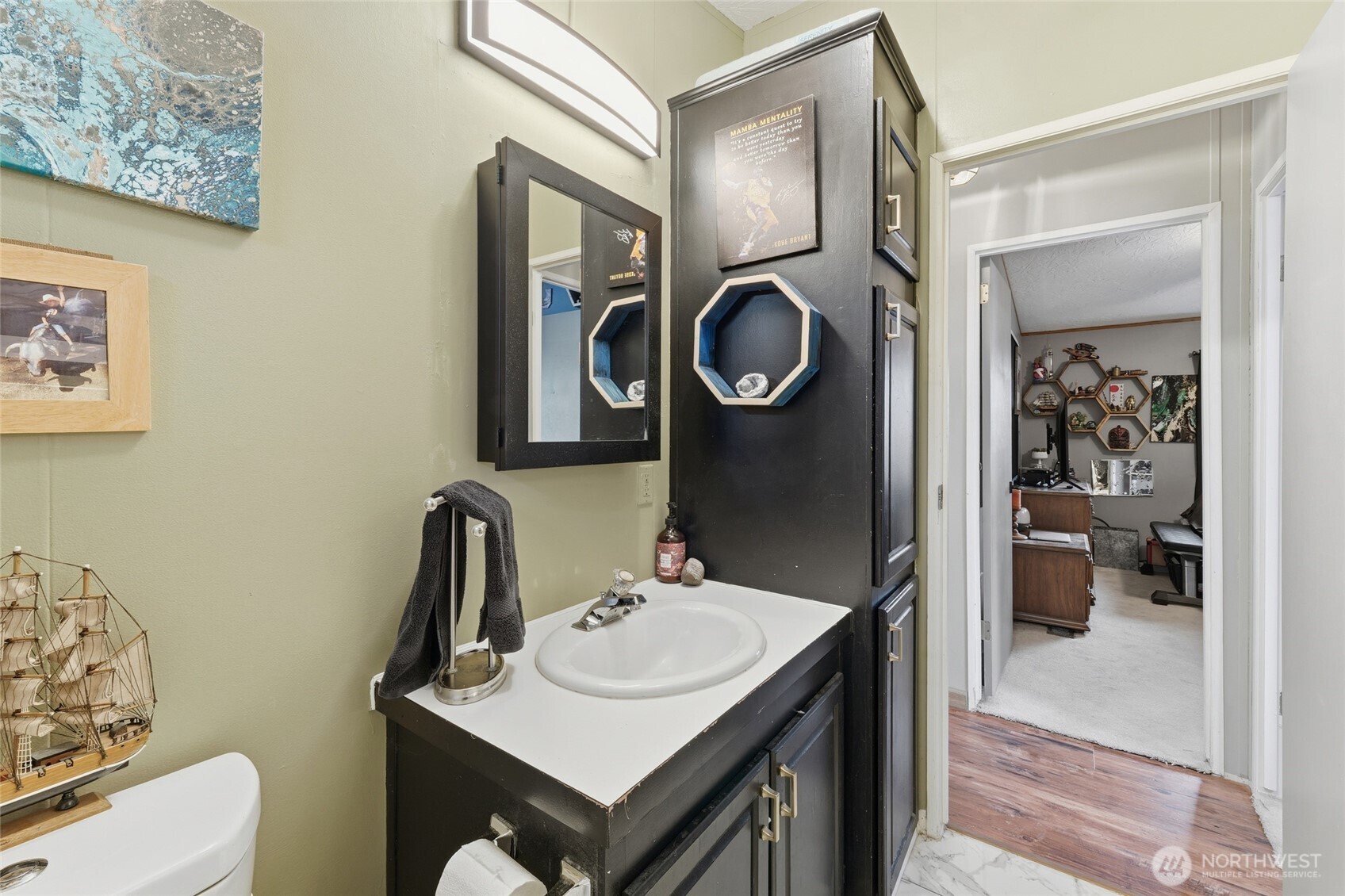 905 Cowl Street Milton Freewater, OR 97862 - Photo 30 of 32 a bathroom with a sink a toilet and a mirror