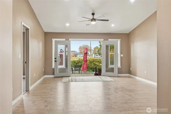 a view of an entryway with wooden floor