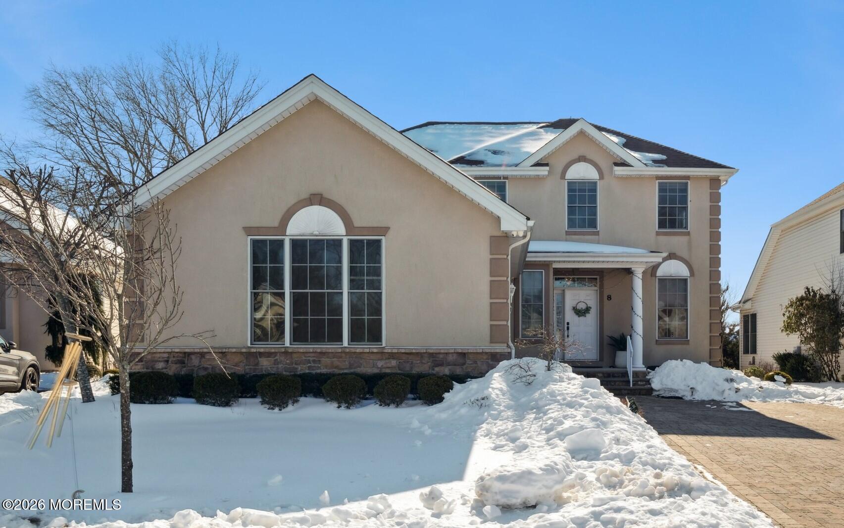 a front view of a house with a yard
