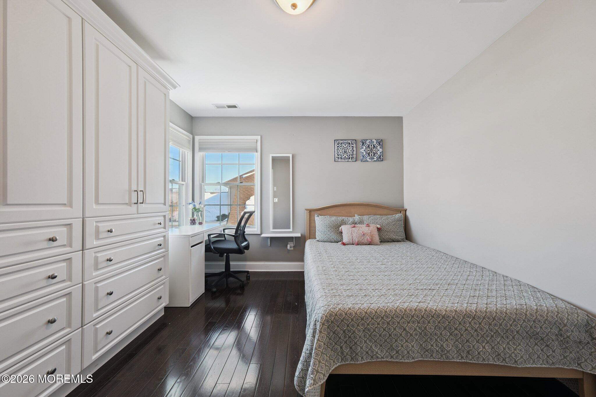 8 Patton Court Manalapan, NJ 07726 - Photo 12 of 23 a bedroom with a white bed and white walls