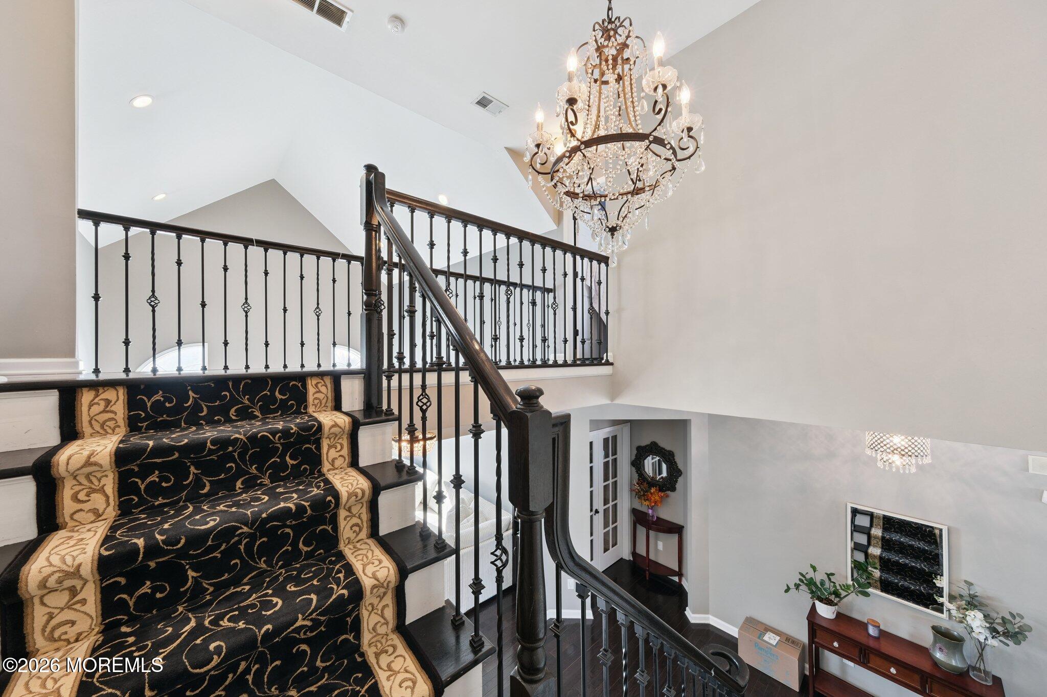 8 Patton Court Manalapan, NJ 07726 - Photo 9 of 23 a view of entryway with wooden floor