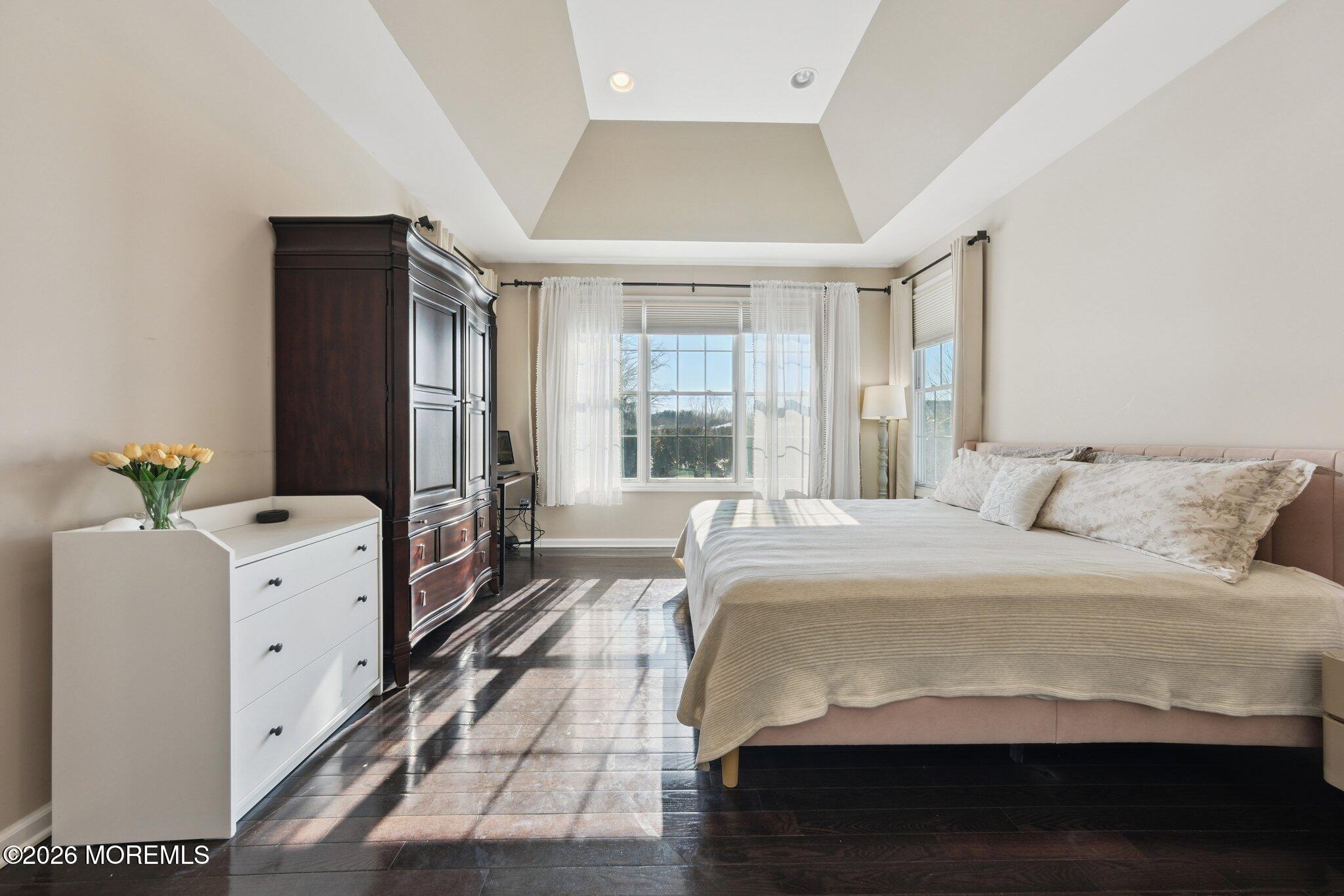 8 Patton Court Manalapan, NJ 07726 - Photo 10 of 23 a spacious bedroom with a bed and a window