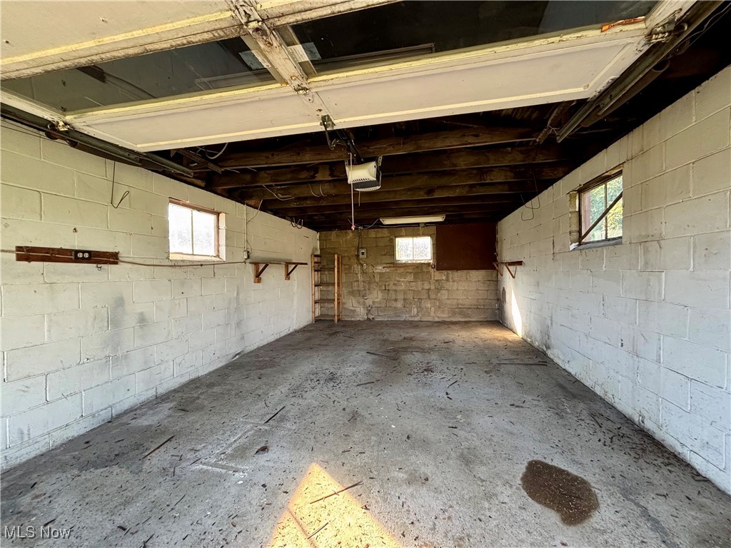 164 Locust Lane Follansbee, WV 26037 - Photo 16 of 19 Garage featuring a garage door opener