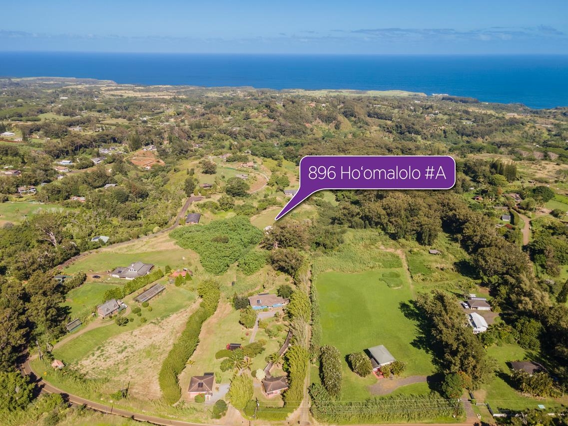 676 Kaupakalua Road, Unit A Haiku, HI 96708 - Photo 13 of 21 a sign board with an ocean view