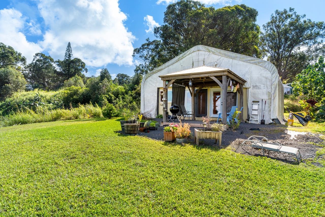 676 Kaupakalua Road, Unit A Haiku, HI 96708 - Photo 8 of 21 a view of a house with backyard and garden