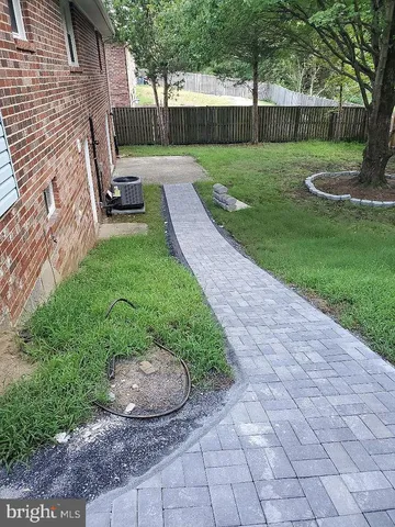 a view of a couches in backyard of the house