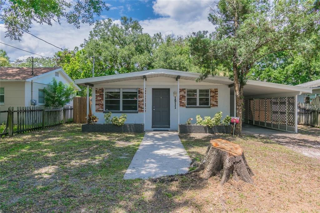 1911 West St Conrad Street Tampa, FL 33607 - Photo 33 of 35 a front view of house with yard having seating