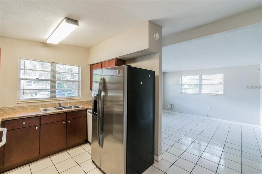 1911 West St Conrad Street Tampa, FL 33607 - Photo 6 of 35 a kitchen with stainless steel appliances granite countertop a refrigerator and a sink