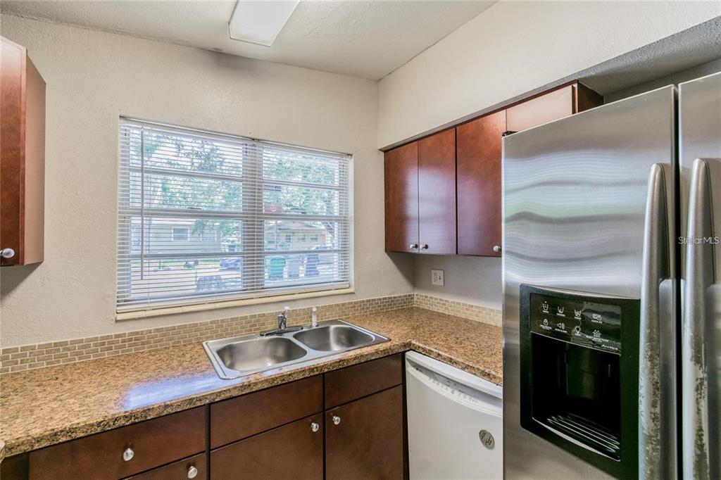 1911 West St Conrad Street Tampa, FL 33607 - Photo 9 of 35 a kitchen with a sink and a window