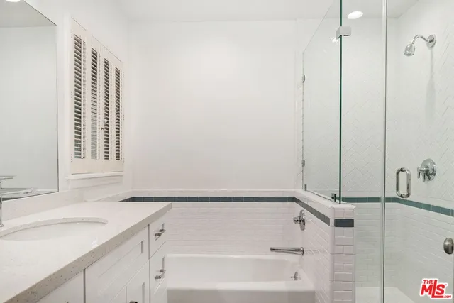 a bathroom with a bathtub and a sink