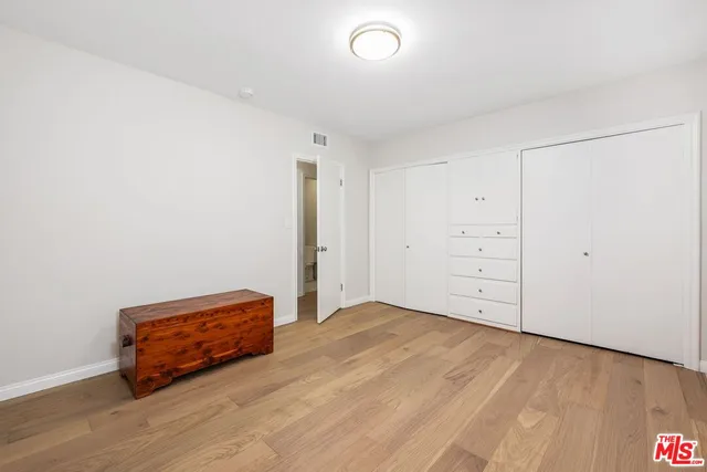 an empty room with wooden floor