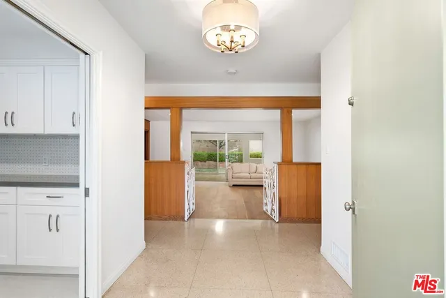 a view of entryway with kitchen