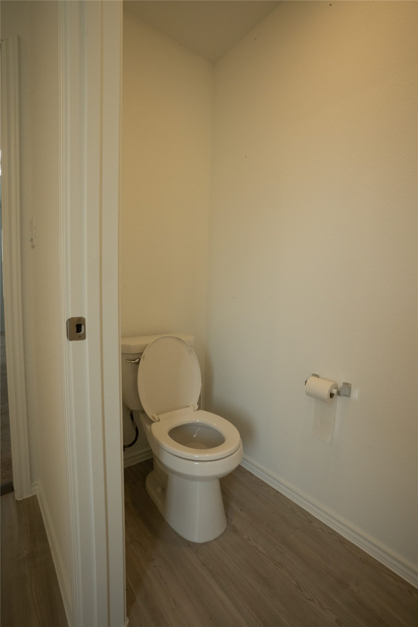 105 Carmello Kyle, TX 78640 - Photo 12 of 30 Bathroom featuring toilet and dark wood-style floors