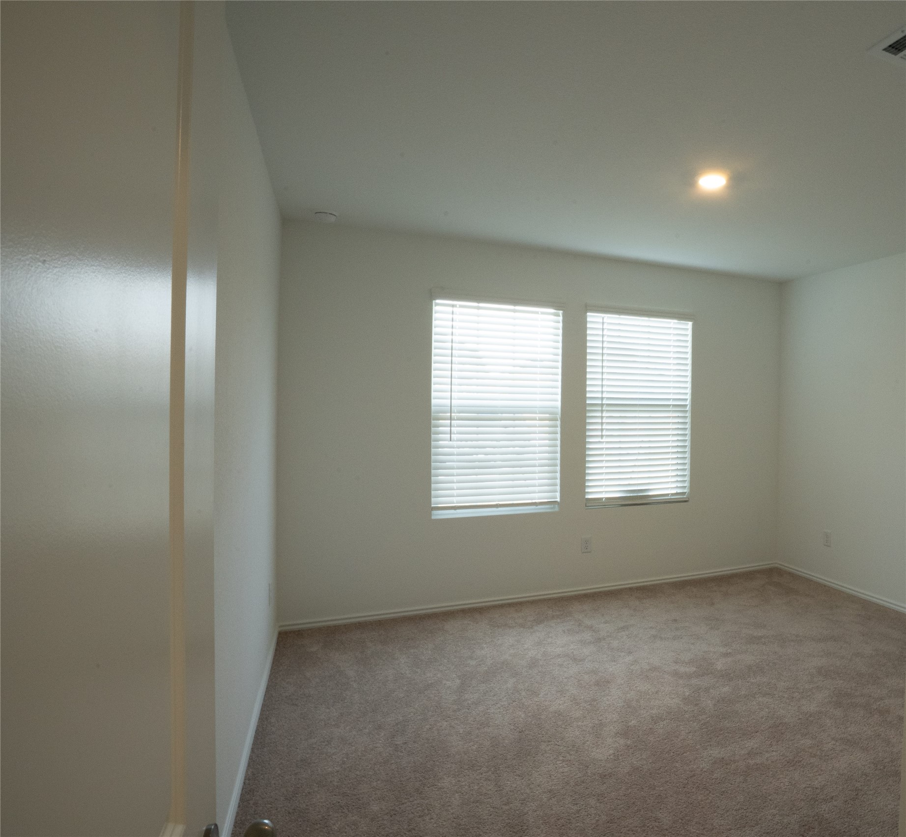 105 Carmello Kyle, TX 78640 - Photo 17 of 30 Spare room featuring light carpet and baseboards