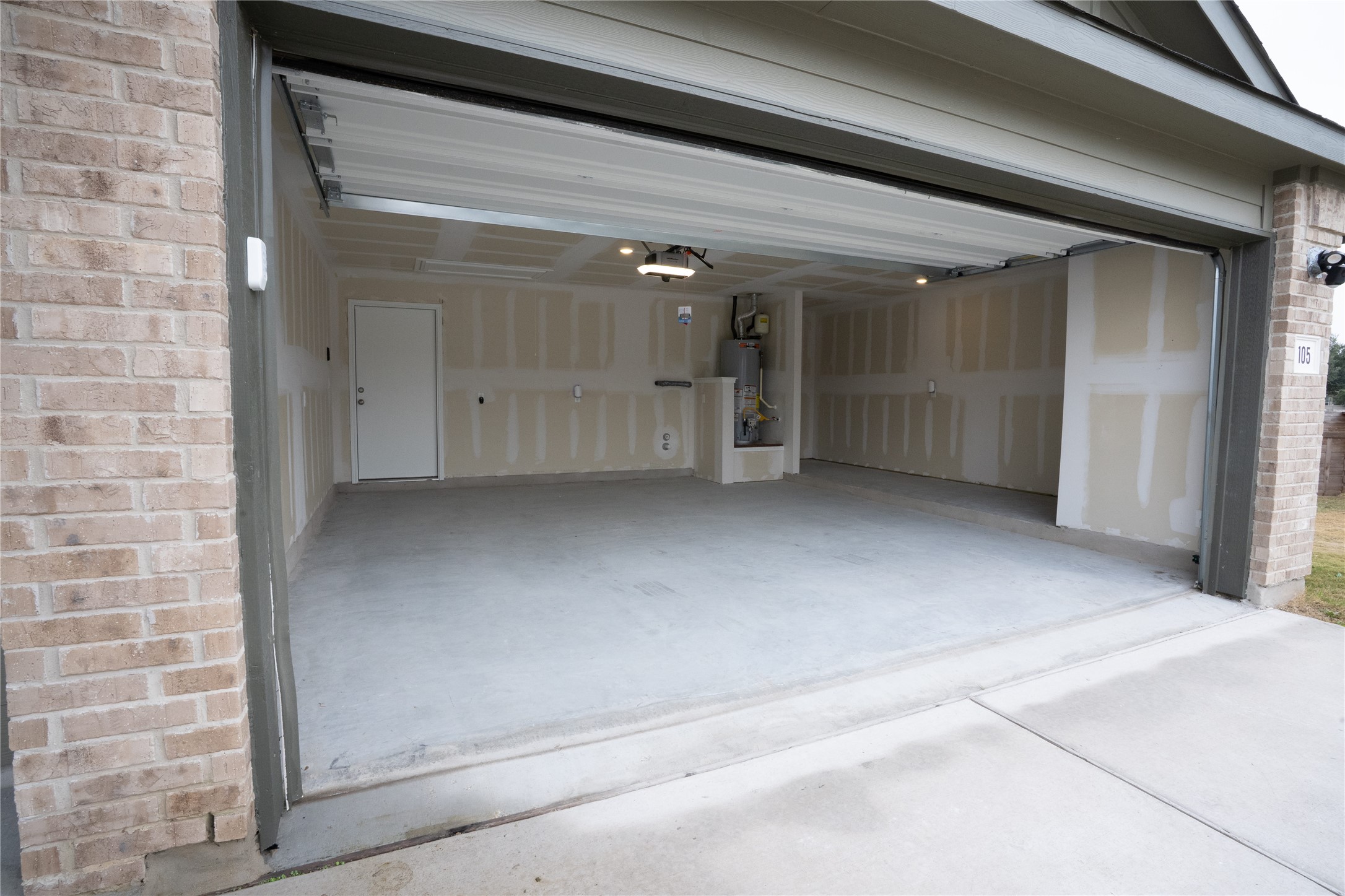 105 Carmello Kyle, TX 78640 - Photo 26 of 30 Garage with water heater