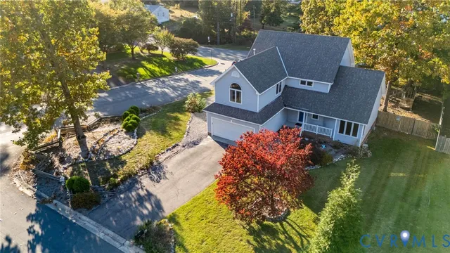 an aerial view of house with yard