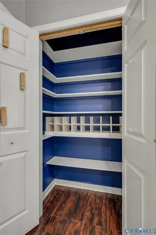 a view of bedroom with wooden floor