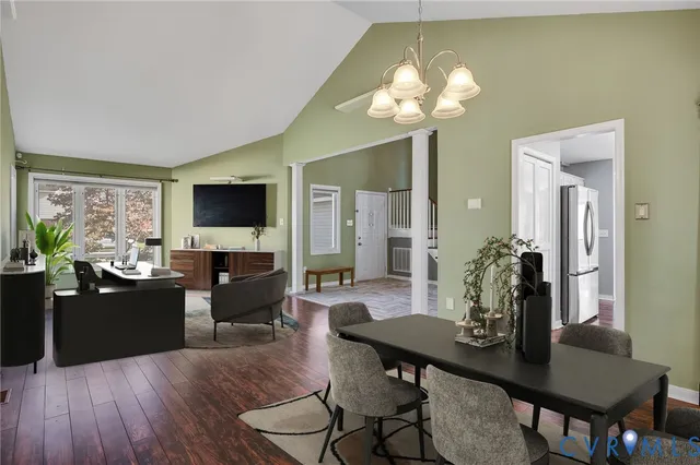 a view of a dining room with furniture and wooden floor