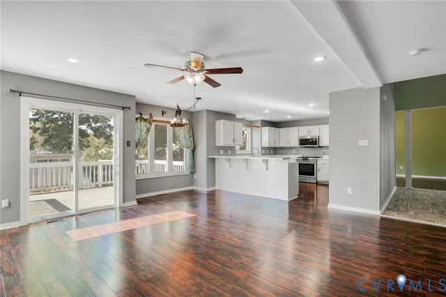 a view of kitchen with cabinets and wooden floor