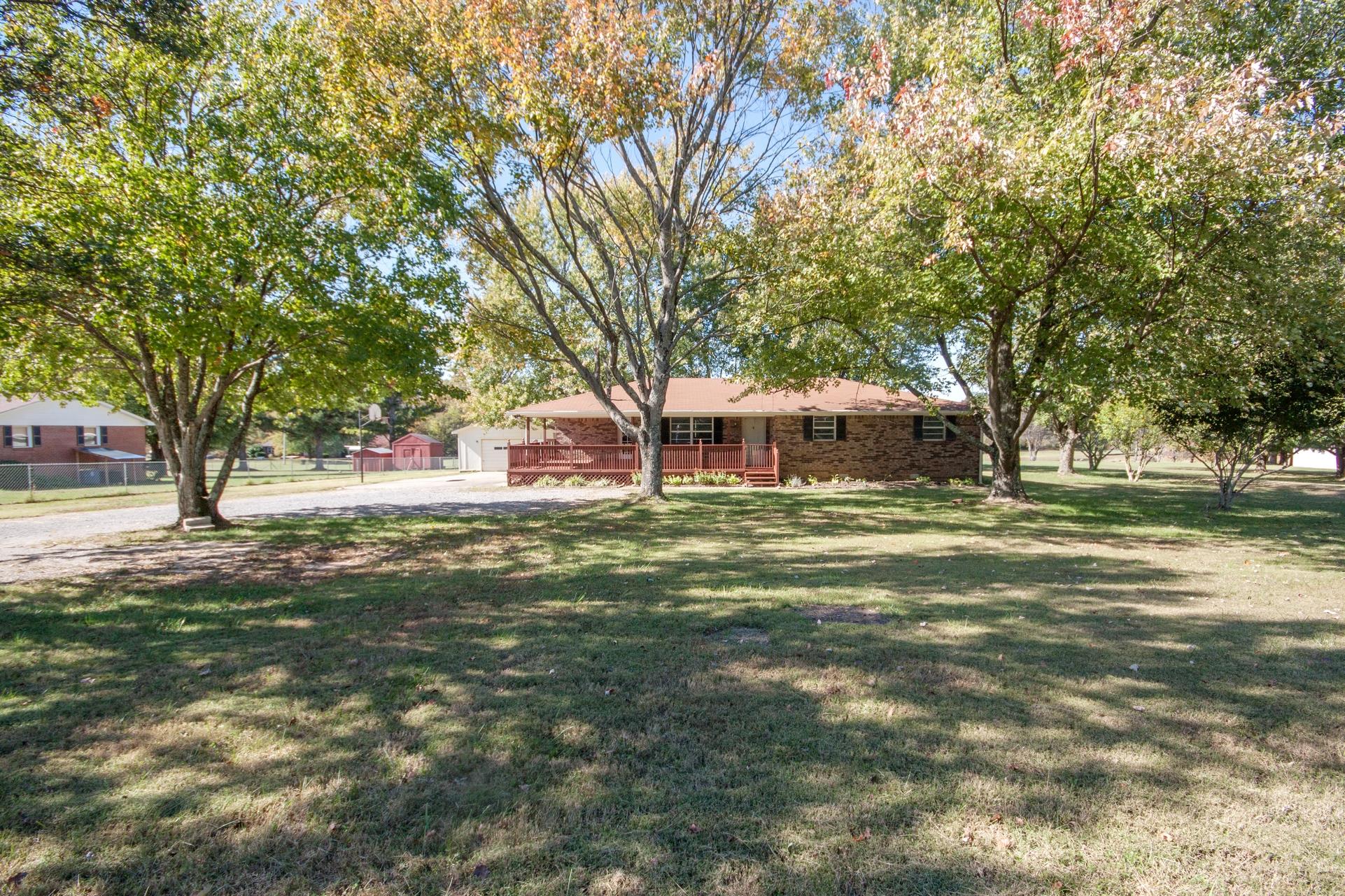 180 Dorris Road Portland, TN 37148 - Photo 1 of 19 a front view of a house with a garden