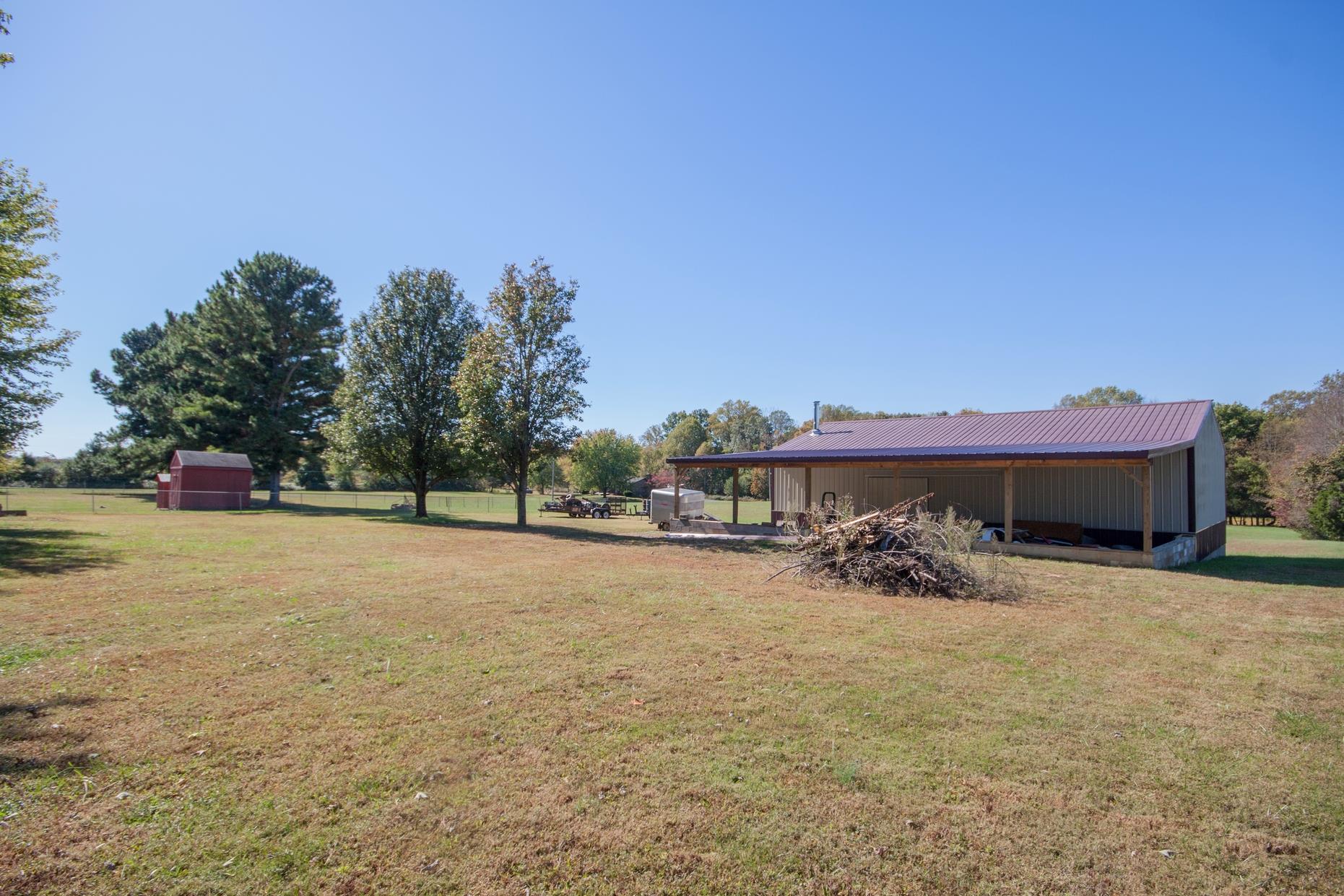 180 Dorris Road Portland, TN 37148 - Photo 14 of 19 a view of a house with a yard and sitting area