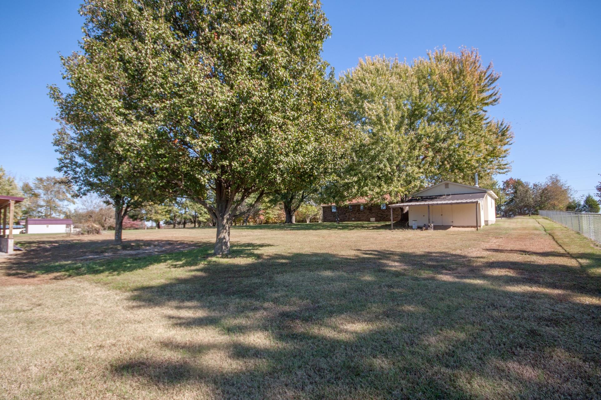 180 Dorris Road Portland, TN 37148 - Photo 15 of 19 a view of a yard with plants and trees