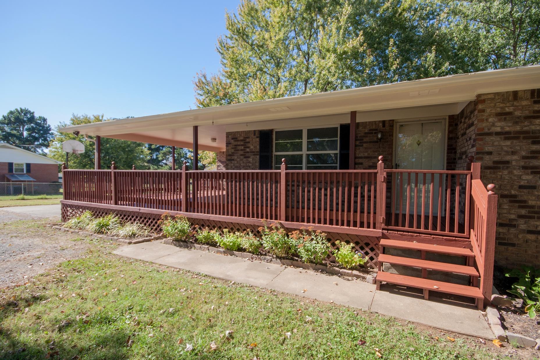 180 Dorris Road Portland, TN 37148 - Photo 3 of 19 a view of a house with wooden fence next to a yard
