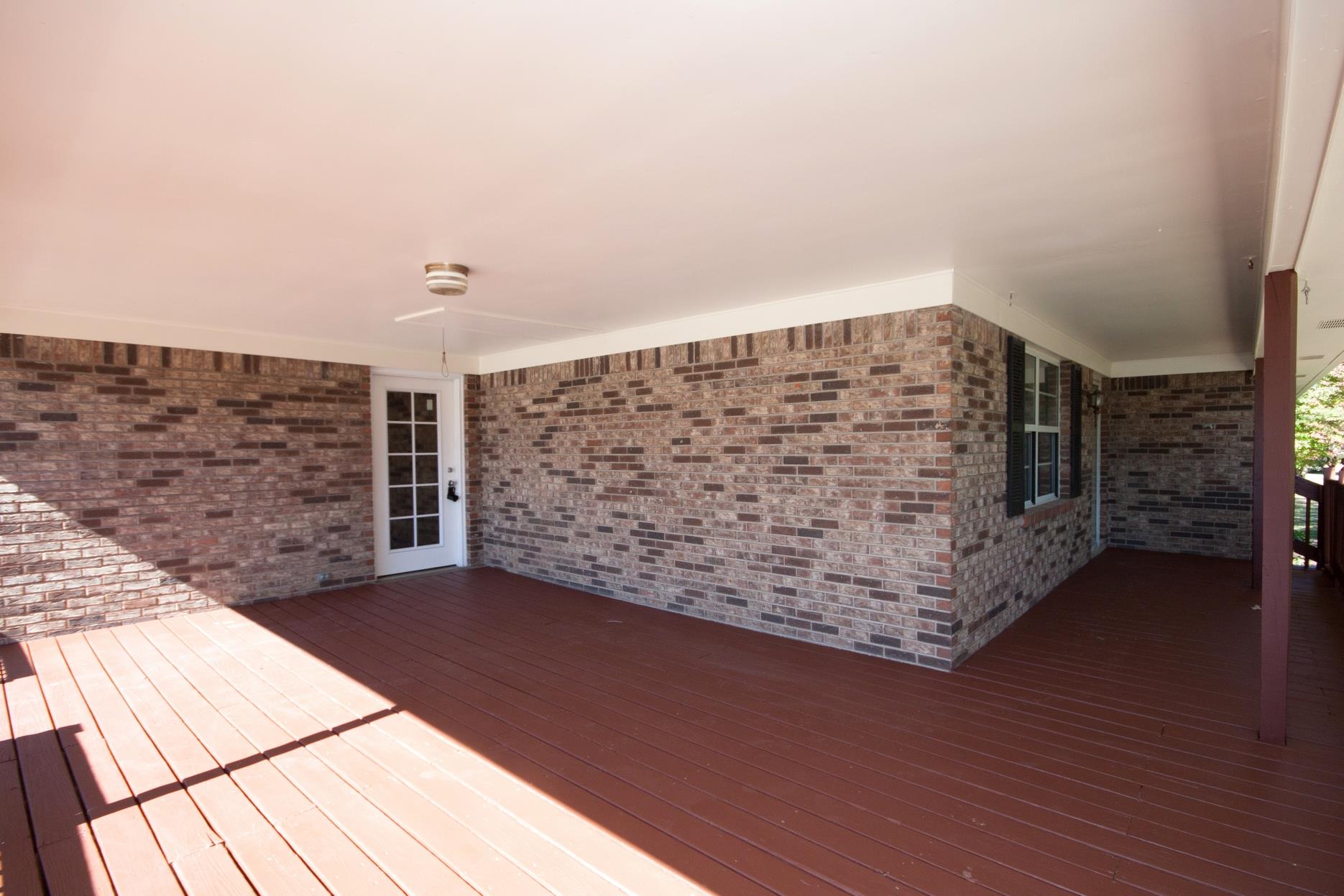 180 Dorris Road Portland, TN 37148 - Photo 6 of 19 a view of outdoor space with wooden floor and brick wall