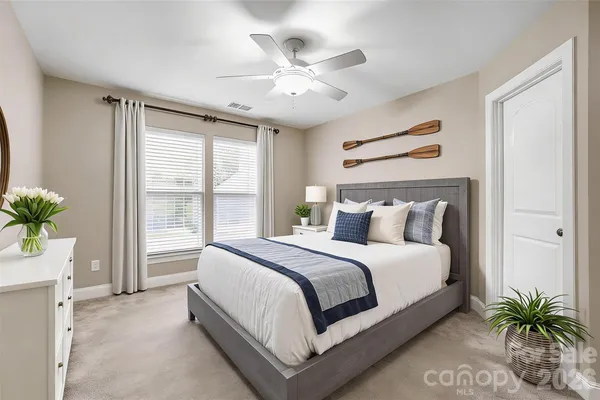 a bed room with a bed and a window