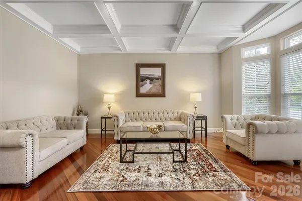 a living room with furniture and a rug